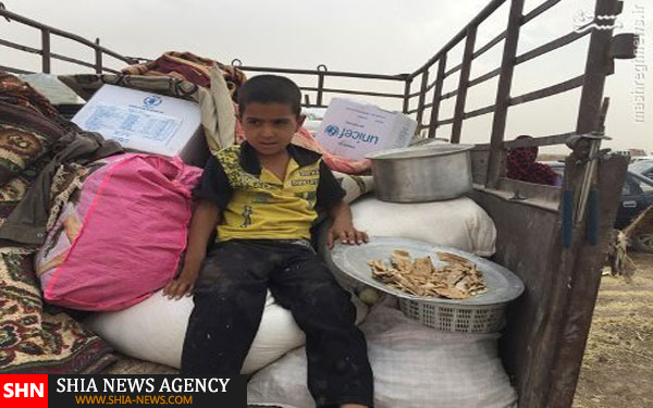 فرار دسته جمعی صدها عراقی از مناطق داعش +تصاویر