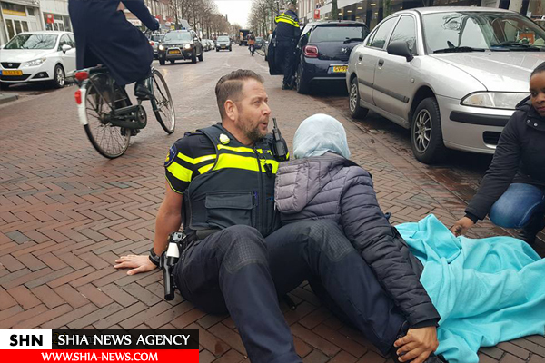 اقدام تحسین برانگیز یک نیروی پلیس هلند برای کمک به زن مسلمان + تصویر