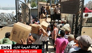 قافلة مساعدات أنسانية تدخل حي الوعر في مدينة حمص