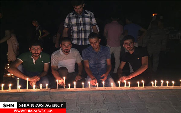 در کربلا به یاد شهدا انفجار اخیر شمع روشن شد + تصاویر