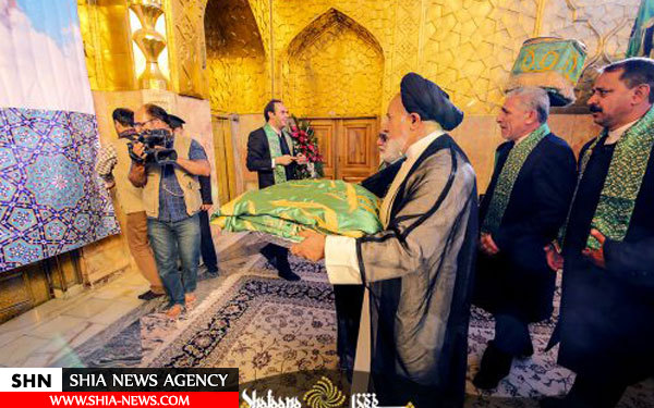 تعویض پرچم حرم امام رضا (ع) با حضور آیت الله العظمی صافی گلپایگانی