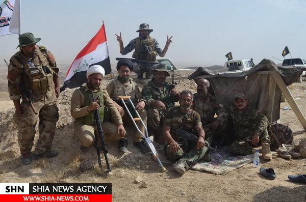 تصاویری از حضور فضلای حوزه علمیه عراق در عملیات آزادسازی منطقه الفتحة