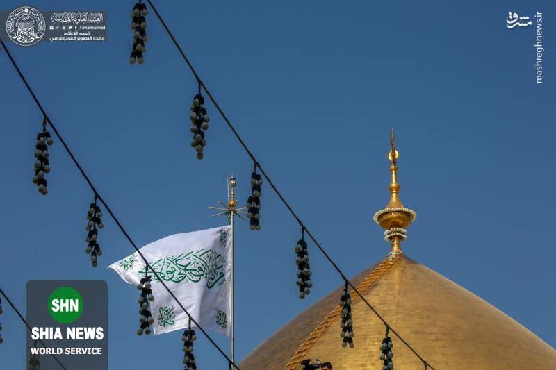 تعویض پرچم ایوان طلای حرم علوی(ع) تعویض پرچم ایوان طلای حرم علوی(ع)