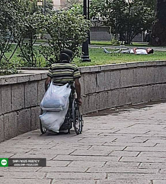 عکسی از یک معلول که قلبتان را به درد می آورد عکسی از یک معلول که قلبتان را به درد می آورد